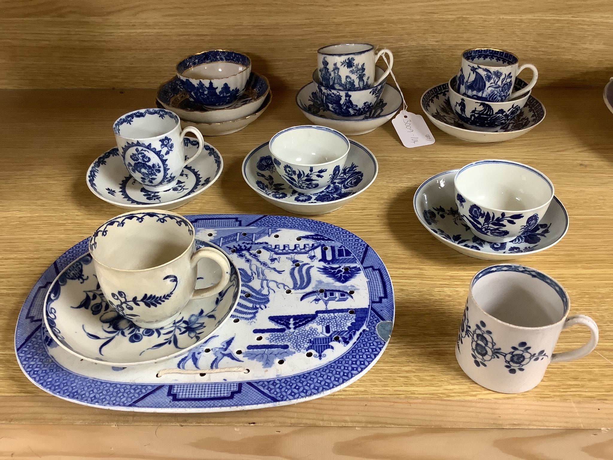 A group of Worcester and Caughley blue and white tea and coffee wares, late 18th century including fisherman pattern, three flowers pattern, chinoiserie figures etc.